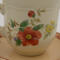 This shows the details of the backside of the flowers and saucer.